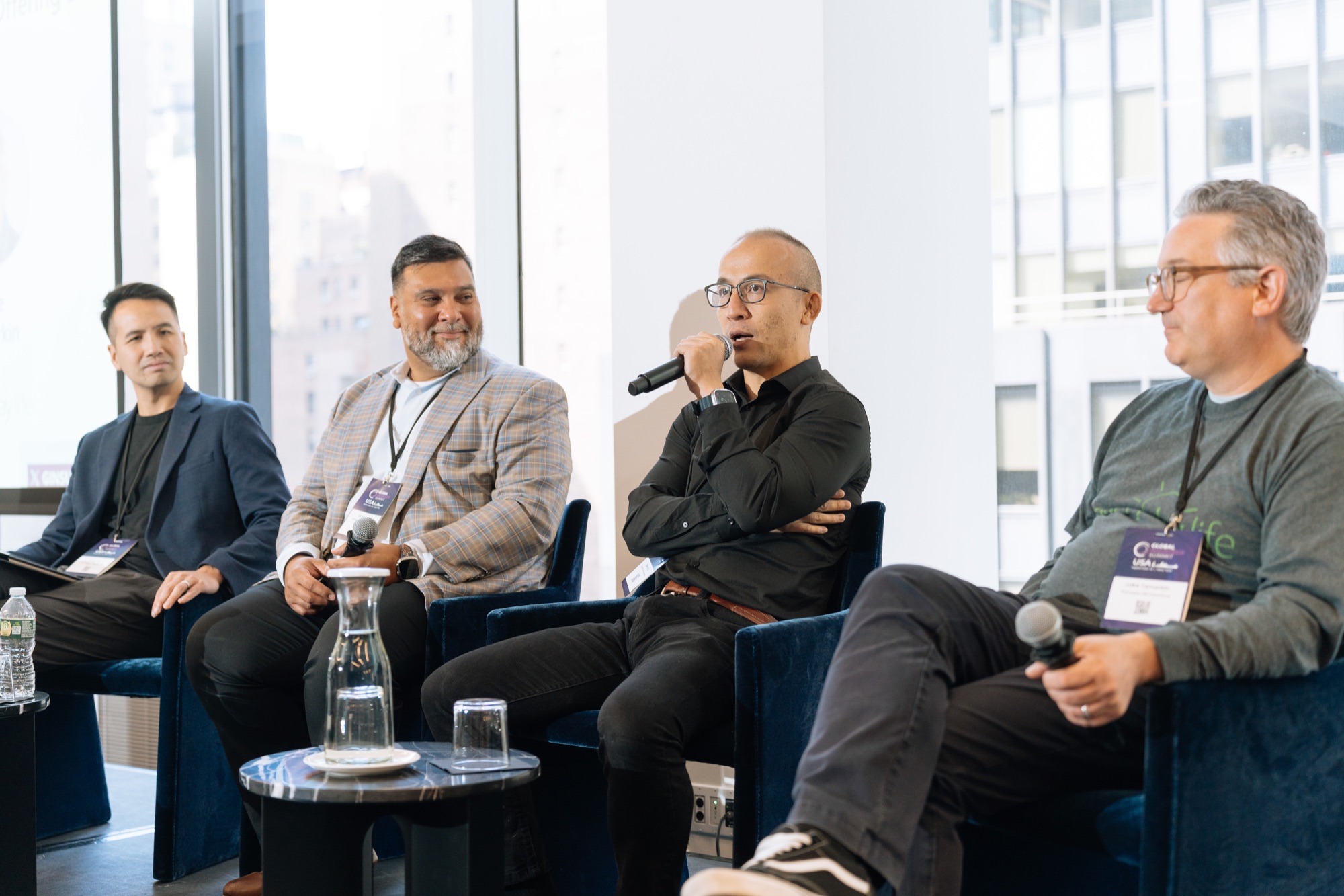Dennis X. Li speaking on an insurance industry panel
